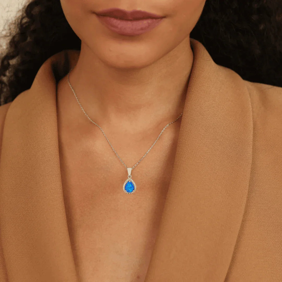 model showcasing Lab Grown Blue Opal Teardrop Pendant with CZ Accents October Birthstone Gift